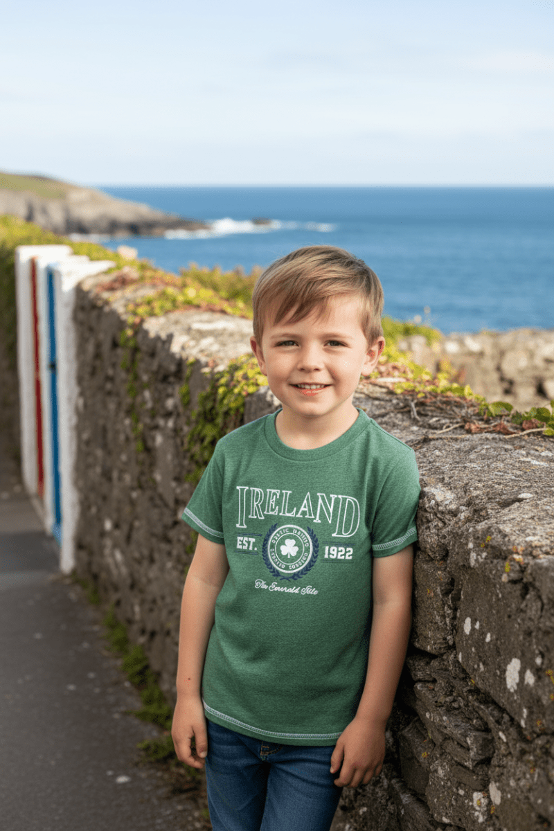 Child wearing a green Ireland Collegiate T-shirt featuring a shamrock crest and Est. 1922.
