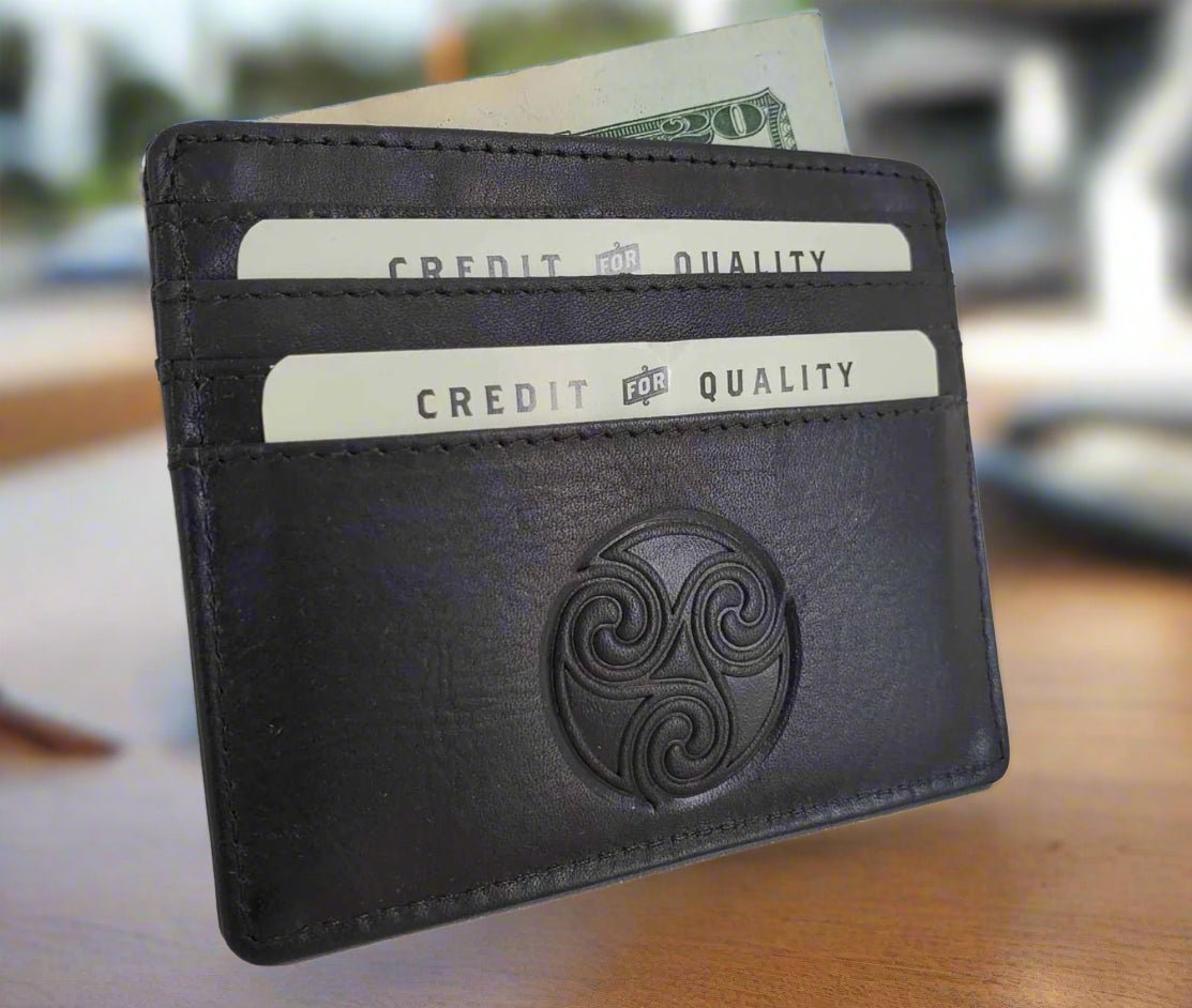 Black leather wallet with embossed design on a white background