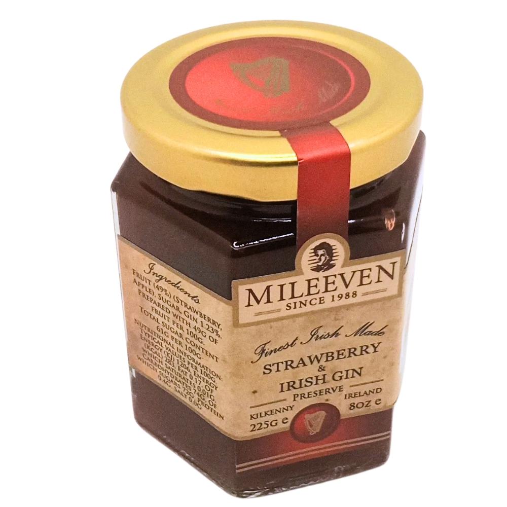 Jar of Mileeven Strawberry Irish Gin Preserve with gold lid on a white background