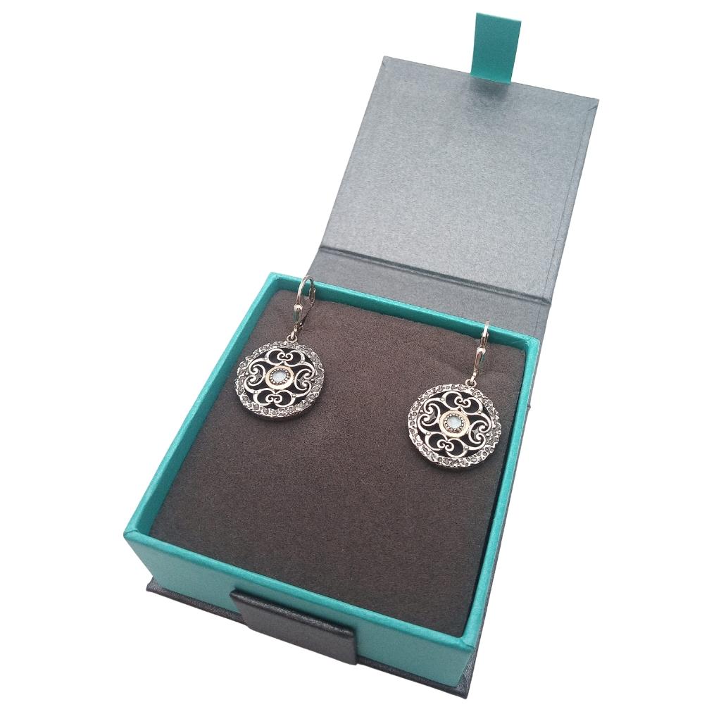 Sterling Silver and 10k Gold Whirlpool Earrings with Sky Blue Topaz
