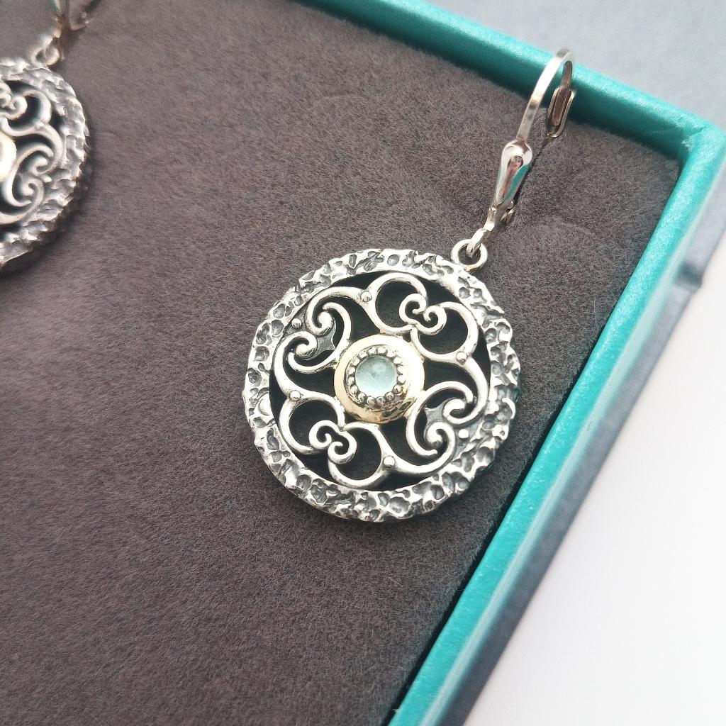 Sterling Silver and 10k Gold Whirlpool Earrings with Sky Blue Topaz