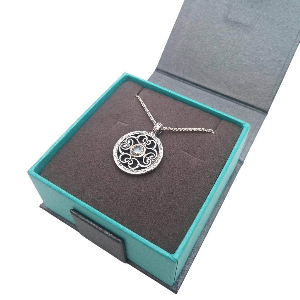 Sterling Silver and 10k Gold Whirlpool Necklace with Sky Blue Topaz