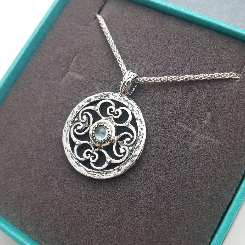 Sterling Silver and 10k Gold Whirlpool Necklace with Sky Blue Topaz