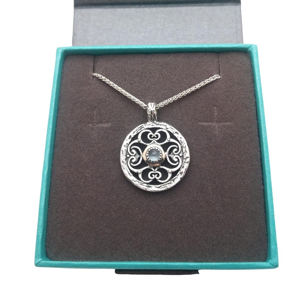 Sterling Silver and 10k Gold Whirlpool Necklace with Sky Blue Topaz