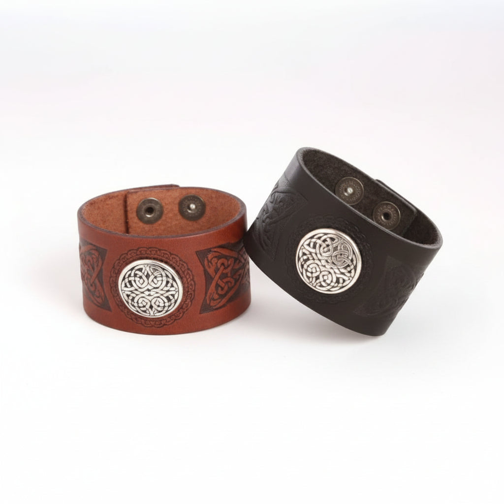 Dara Snap Cuff: leather wristband with Eternal Knot concho on embossed veg-tanned band; snap clasp; sizes 7 and 7.5.